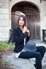 Attractive young brunette  with hat posing.