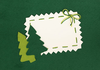 Christmas empty postcard  and new year trees on green background