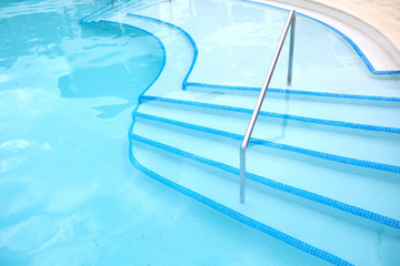 Swimming pool ladder.