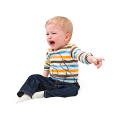 The crying one-year-old child, points a finger