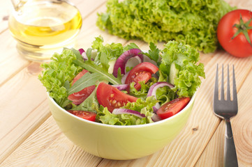 Fresh salad with cucumbers tomatoes and onions