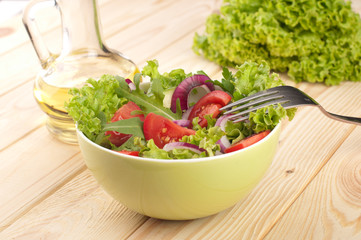 Fresh salad with cucumbers tomatoes and onions
