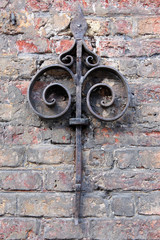 old stone wall with metal decor