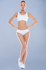 Obraz premium Attractive young woman with perfect body in white underwear