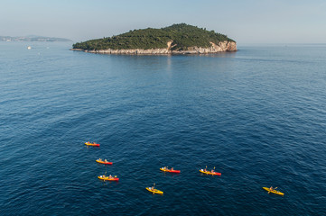 Tourists with canoes in Dubrovnik sea, Croatia