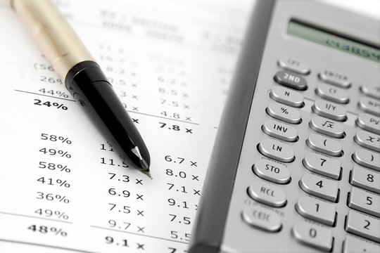 Pen and Calculator on the Financial Document