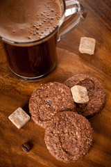 Cup of espresso, sugar, and chocolate chip cookies