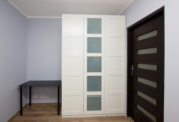 Modern apartment interior with wardrobe