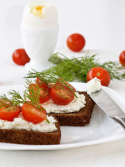 breakfast sandwich of cottage cheese and red tomato, egg