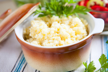 Porridge of millet in a ceramic pot