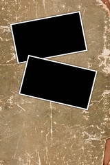 Old photo frames on a grungy paper background