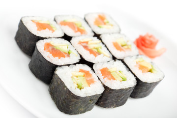 Sushi rolls with sashimi, isolated on white