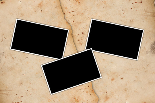 Blank photo frames on a paper background