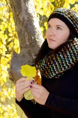 Beautiful woman in autumn forrest