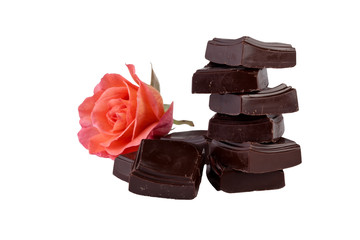 chocolate pieces tower with flower isolated on white