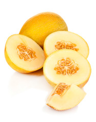 Cut ripe melons isolated on white