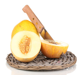 Ripe melons on wicker cradle isolated on white