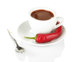 white cup with hot chocolate and chili pepper isolated on white
