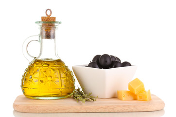 Black olives in white bowl with rosemary,olive oil and cheese