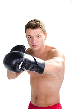 Muscular man boxing