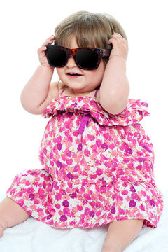 Cute little toddler wearing classy shades