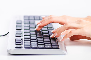 Obraz na płótnie Canvas Hands working on the keyboard