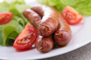 grilled sausage and salad