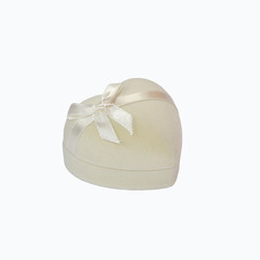 Romantic jewelry box in the form of white heart with a satin bow