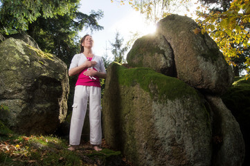 Relaxing Woman between Rocks