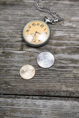 Old clock and coins