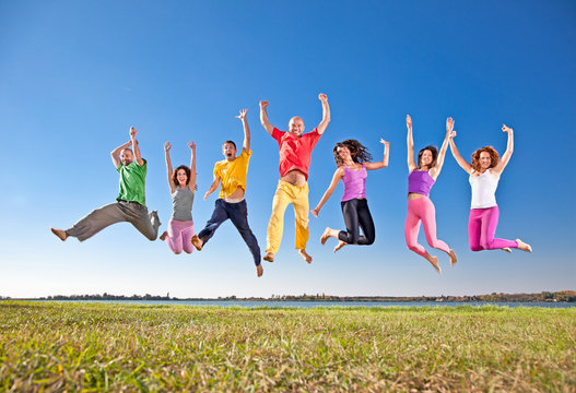 Happy smiling  group of jumping  people