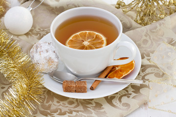 cup of tea with orange and cake