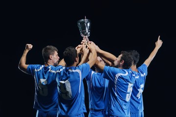 soccer players celebrating victory