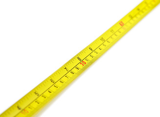 yellow tape measure on a white background