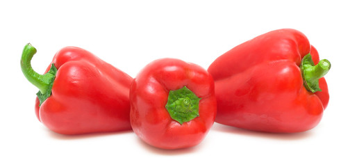 three peppers on a white background close-up