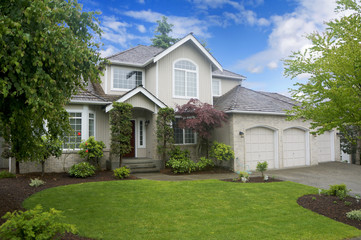 Large classic American house with three car garage.