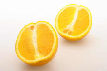 Half orange fruit on white background