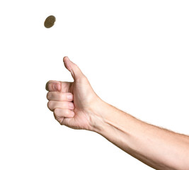 Man's arm and hand tossing golden coin