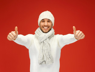 handsome man in warm sweater, hat and scarf