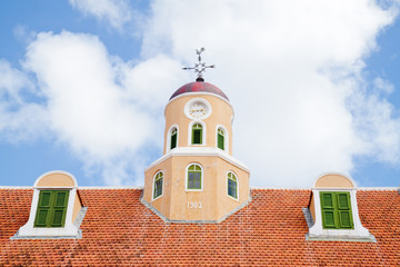 Old clock roof tower and two dormers