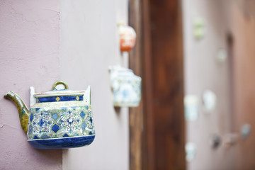 A teapot embedded into the facades of tea-shop