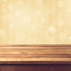 Golden bokeh background with wooden table