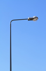 Street light with halogen lamp against blue sky - 46073434