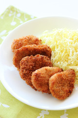 Breaded pork cutlet with cabbage