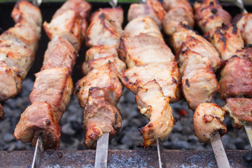 meat beeing prepared on grill