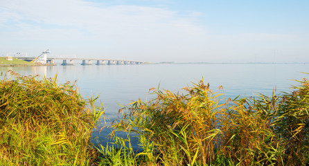 Bridge over a lake at fall