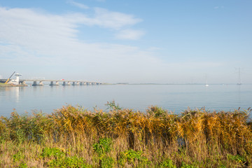 Bridge over a lake in a haze