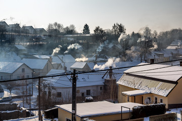 non ecologic smoking chimneys in small village