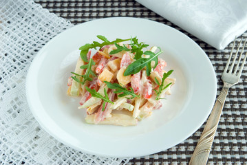 Salad with apples, cheese, tomatoes, arugula