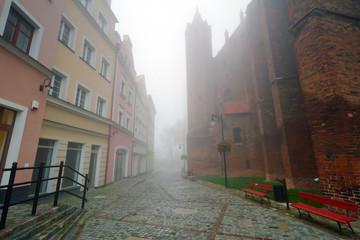 Foggy street of Kwidzyn castle and cathedral, Poland